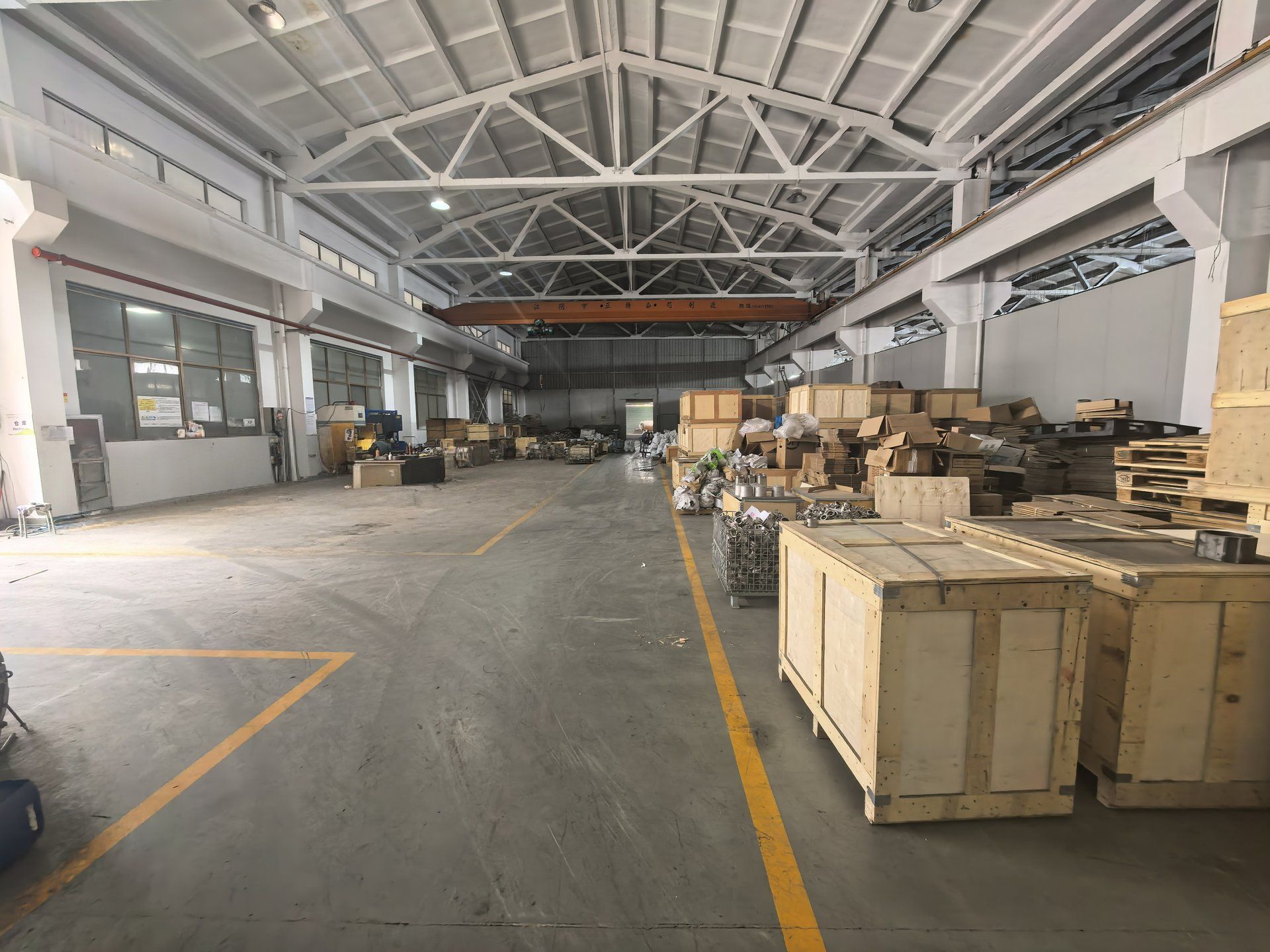 Finished Goods Warehouse - Large Storage Facility with Wooden Crated Castings Ready for Export Shipment | Huayong Metal
